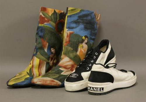 Lot 1089 - A pair of Chanel black and white trainers