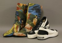 Lot 1089 - A pair of Chanel black and white trainers