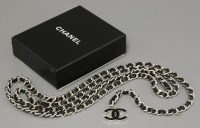 Lot 1095 - A Chanel lambskin black leather and silver-tone chain logo belt