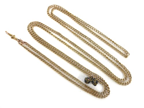 Lot 33 - A hollow curb link gold guard chain with a swivel clip to one end