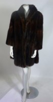 Lot 1104 - A dark brown mid-length mink fur coat