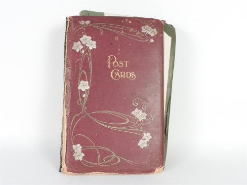 Lot 134 - A postcard album with over 150 cards