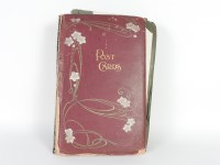 Lot 134 - A postcard album with over 150 cards
