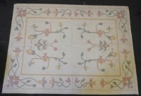 Lot 631 - An arts and crafts style flat weave cream rug