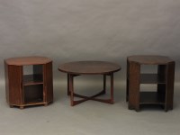 Lot 630 - An A H McIntosh circular occasional table together with an octagonal table drinks cabinet/bookcase