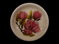 Lot 194 - A Moorcroft plate decorated with magnolia flowers