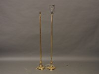 Lot 666 - A pair of gilt standard lamps