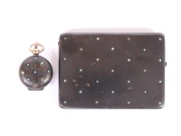 Lot 82 - An early 20th century Russian gunmetal cigarette case set with with cabochon turquoise