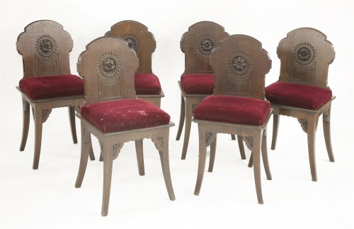 Lot 10 - A set of six oak hall chairs