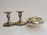 Lot 161 - A hallmarked silver triple handled bowl and a pair of silver dwarf candlesticks