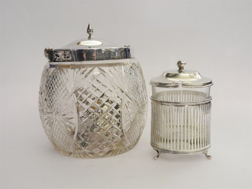 Lot 175 - A cut glass biscuit barrel with silver cover