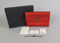 Lot 1248 - An Anya Hindmarch red glitter clutch bag