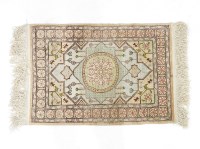 Lot 468 - A Nepalese silk cream ground prayer rug