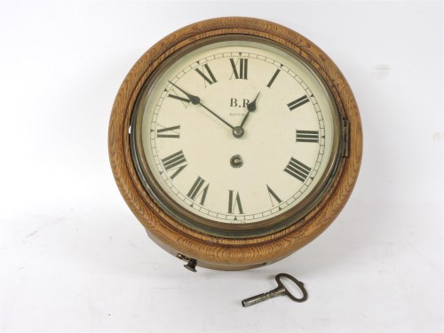 Lot 132 - An oak case wall clock