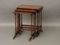 Lot 576 - A mahogany and rosewood banded nest of tables