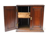 Lot 603 - A small 19th century mahogany two door cabinet