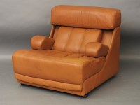 Lot 657 - A 1960's tan leather armchair