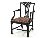 Lot 451 - A Chippendale design carved mahogany elbow chair