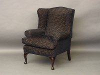 Lot 585 - A Multi York wing armchair