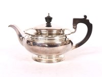 Lot 173 - A 20th century silver teapot of squat form