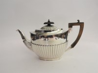 Lot 184 - A Victorian hallmarked silver teapot of ovoid form with reeded decoration