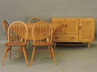 Lot 704 - A light elm Ercol sideboard