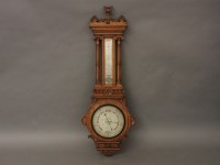 Lot 494 - A Victorian honey oak barometer