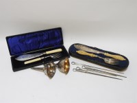 Lot 440 - Two silver plated wine funnels