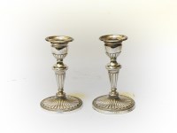 Lot 168 - A pair of silver neo classical candlesticks