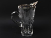 Lot 261 - A silver rimmed cut glass water jug