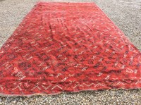 Lot 777 - A large burgundy ground kelim rug