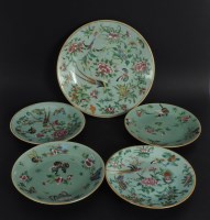 Lot 292 - Five 19th century Famille rose on celadon ground plates