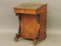 Lot 686 - A 19th century walnut Davenport