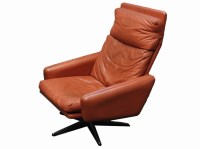 Lot 568 - A 1970's red leather swivel chair