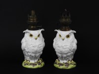 Lot 197 - A pair of porcelain moulded owl table lamps