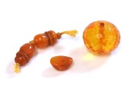 Lot 201 - A large faceted amber bead