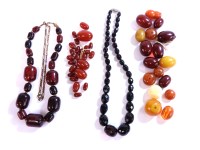 Lot 213 - A row of faceted Bakelite olive bead (black cherry)