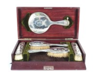 Lot 263 - A cased George V silver dressing table set