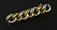 Lot 106 - An early 20th century platinum and gold curb link chain brooch