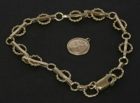 Lot 44 - A gold twisted hoop and bar link bracelet