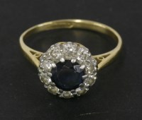 Lot 144 - A gold sapphire and diamond cluster ring