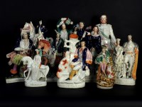 Lot 500 - A collection of ten Victorian and later Staffordshire flat back figures and groups