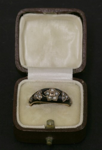 Lot 71 - A rose gold black enamel diamond and split pearl memorial ring