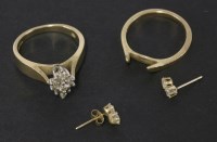 Lot 124 - An American diamond set lozenge shaped cluster ring/wedding ring