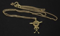 Lot 127 - A 9ct gold jester pendant