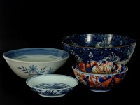 Lot 322 - A blue and white dish with a dragon amongst flames