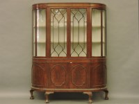 Lot 734 - An early 20th century mahogany bow end display cabinet