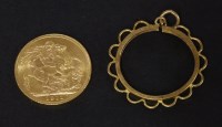 Lot 141 - A 1911 sovereign and a gold channel set scroll mount
