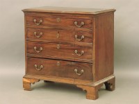 Lot 677 - A George III mahogany small chest of four graduated long drawers