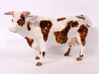 Lot 500 - A French? glazed pottery cow